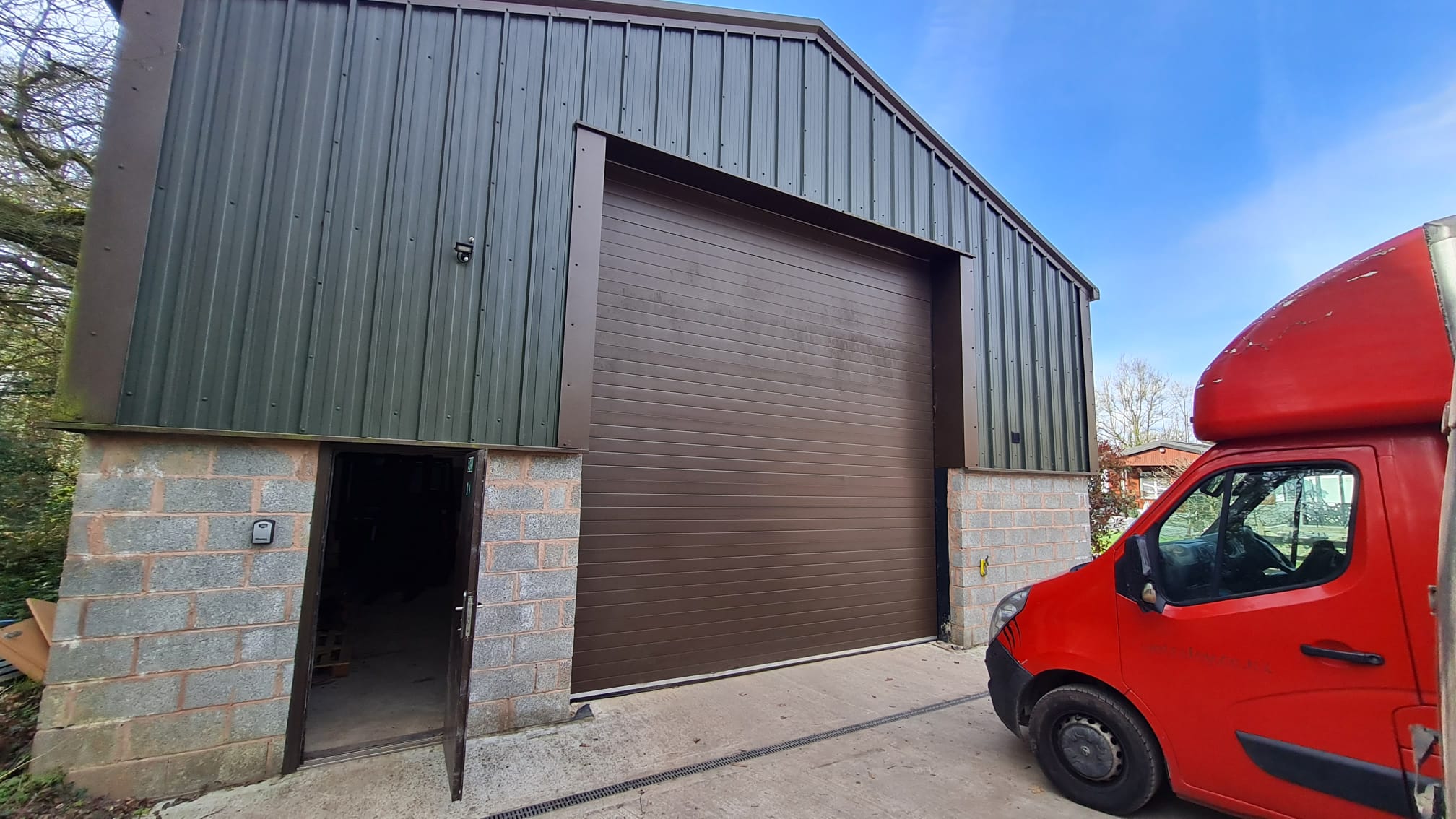 Giant Freight warehouse exterior — steel-frame building with roller shutter