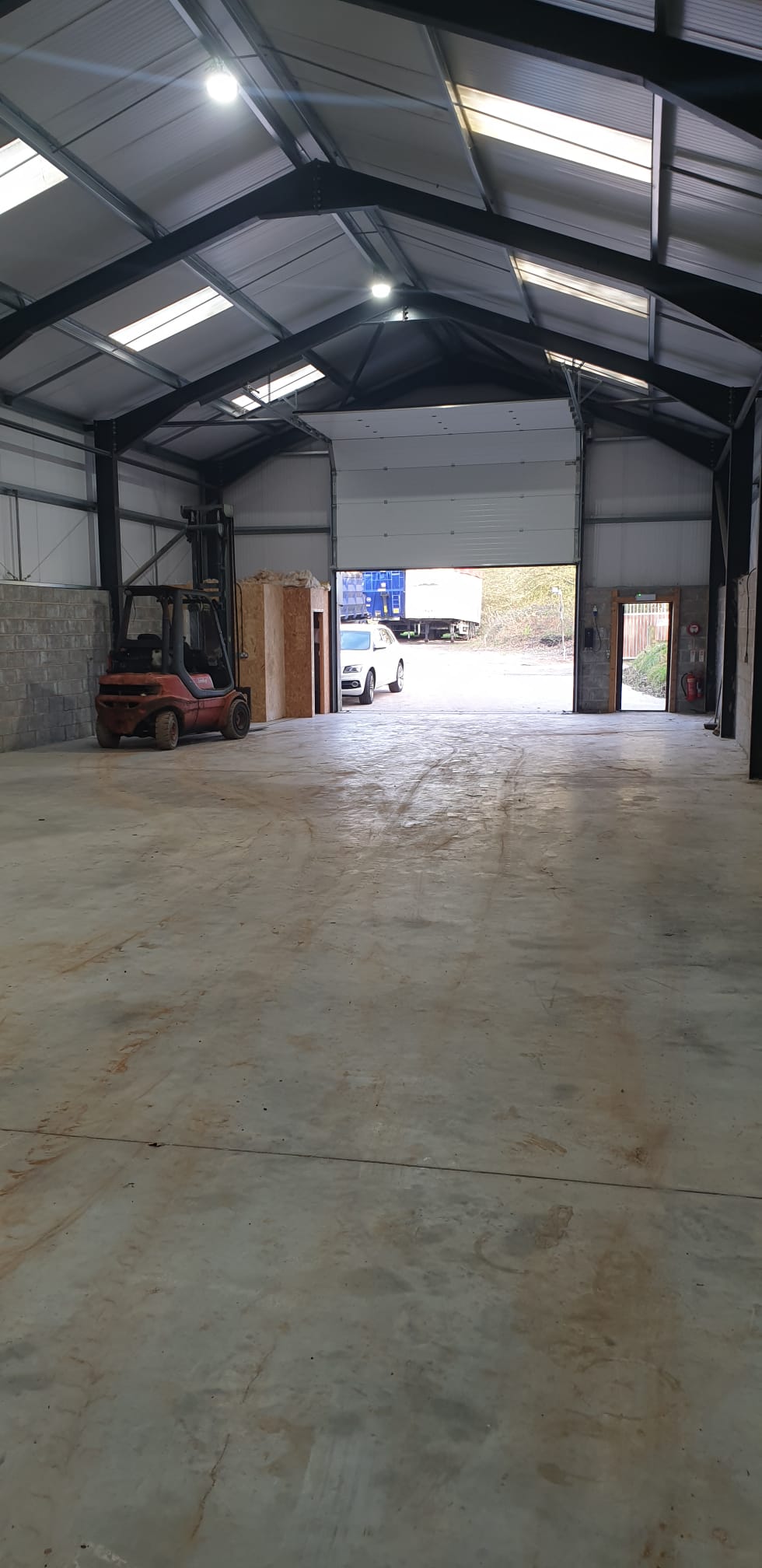 Warehouse interior looking towards rear wall with office pod